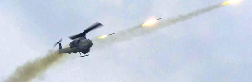A helicopter shooting missiles.